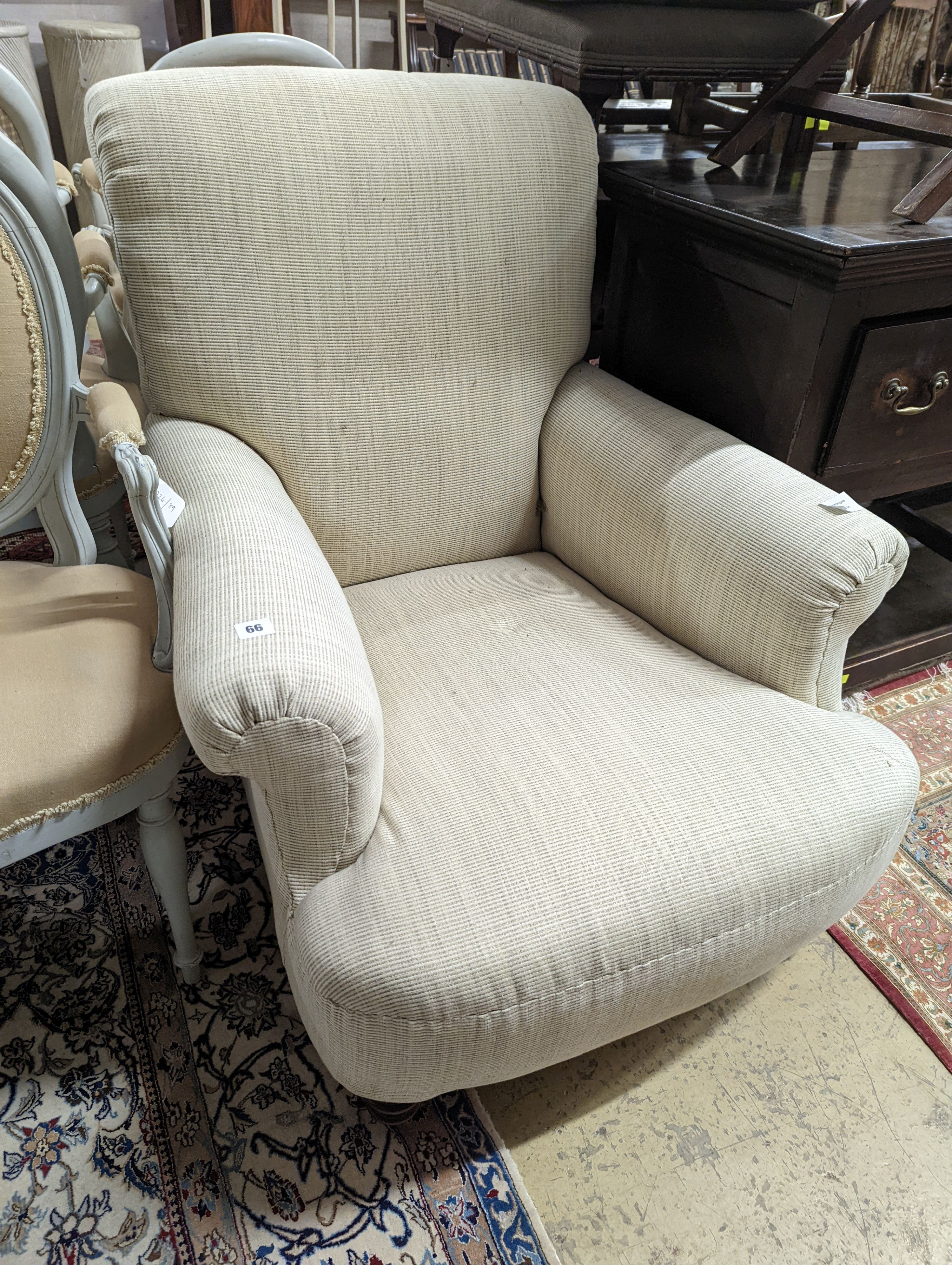 A late Victorian Howard style upholstered armchair, width 81cm, depth 82cm, height 92cm